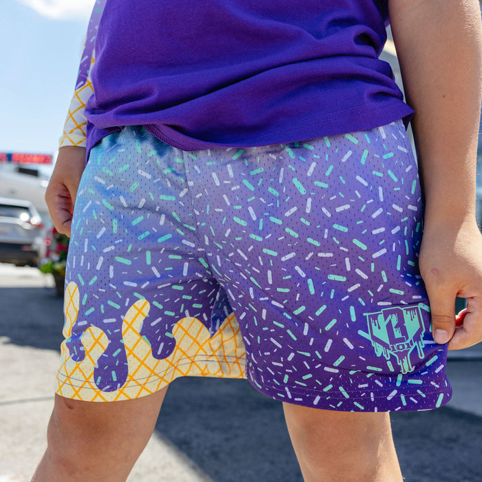 Youth model wearing ice Cream Galaxy Grape youth shorts