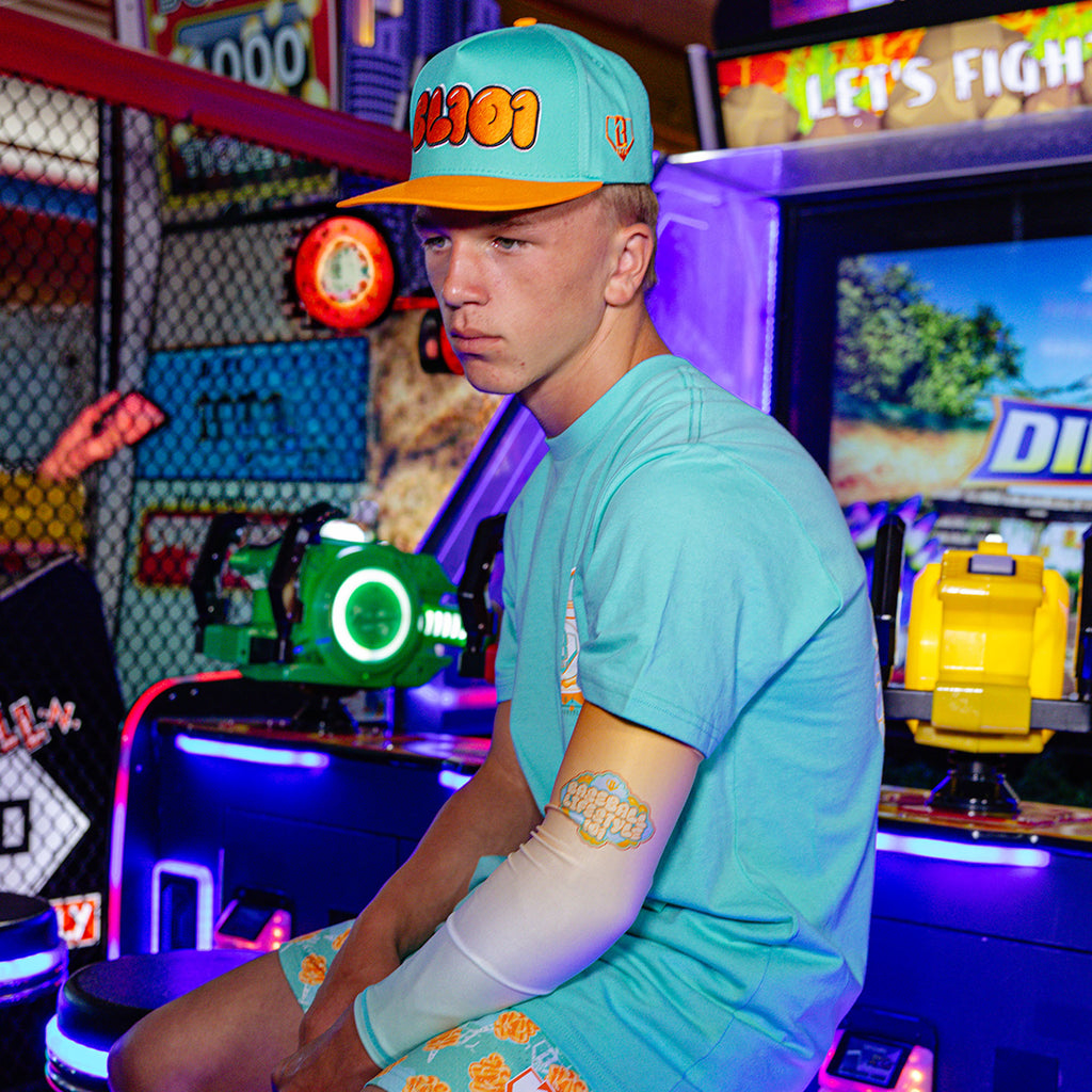 Adult model wearing Cotton Candy Tangerine Freeze arm sleeve
