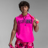 Person wearing a bright pink sleeveless hoodie with 'BSBLSZN' logo, holding a pink bat against a gray background.