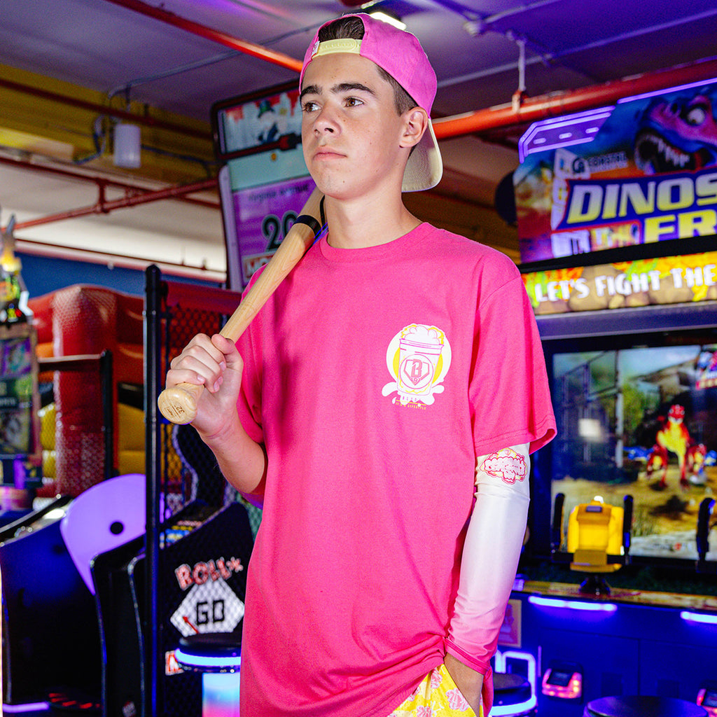 Youth model wearing Cotton Candy Pink Lemonade youth arm sleeve