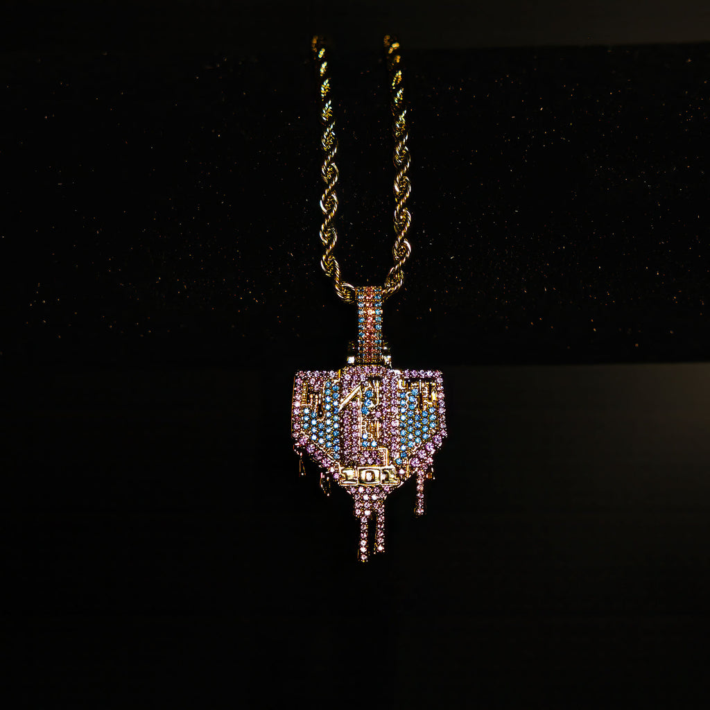 Yellow Gold BL101 Drip Plate necklace hanging on a display stand against a black background
