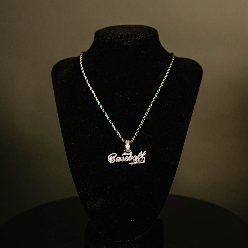 White Gold BL101 Established necklace hanging on a display stand against a black background