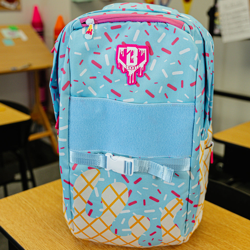 Blue backpack with "Cotton Candy Ice Cream  SZN 2" design — back view