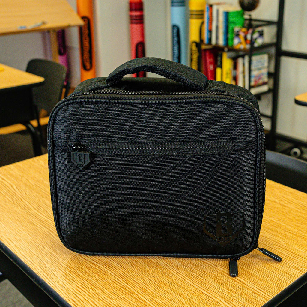 Adult model wearing black lunch box with "SZN 2" design