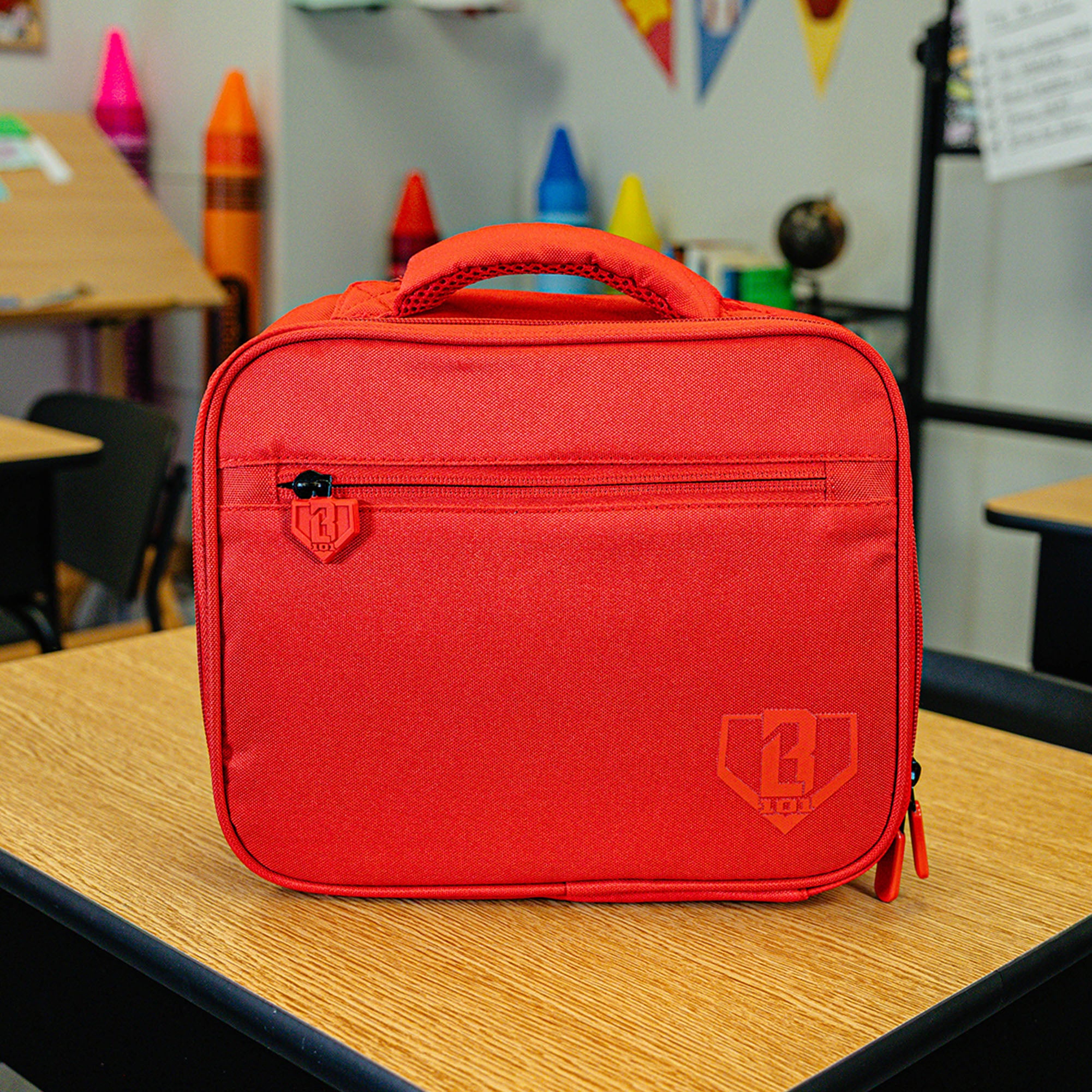 Adult model wearing red lunch box with "SZN 2" design