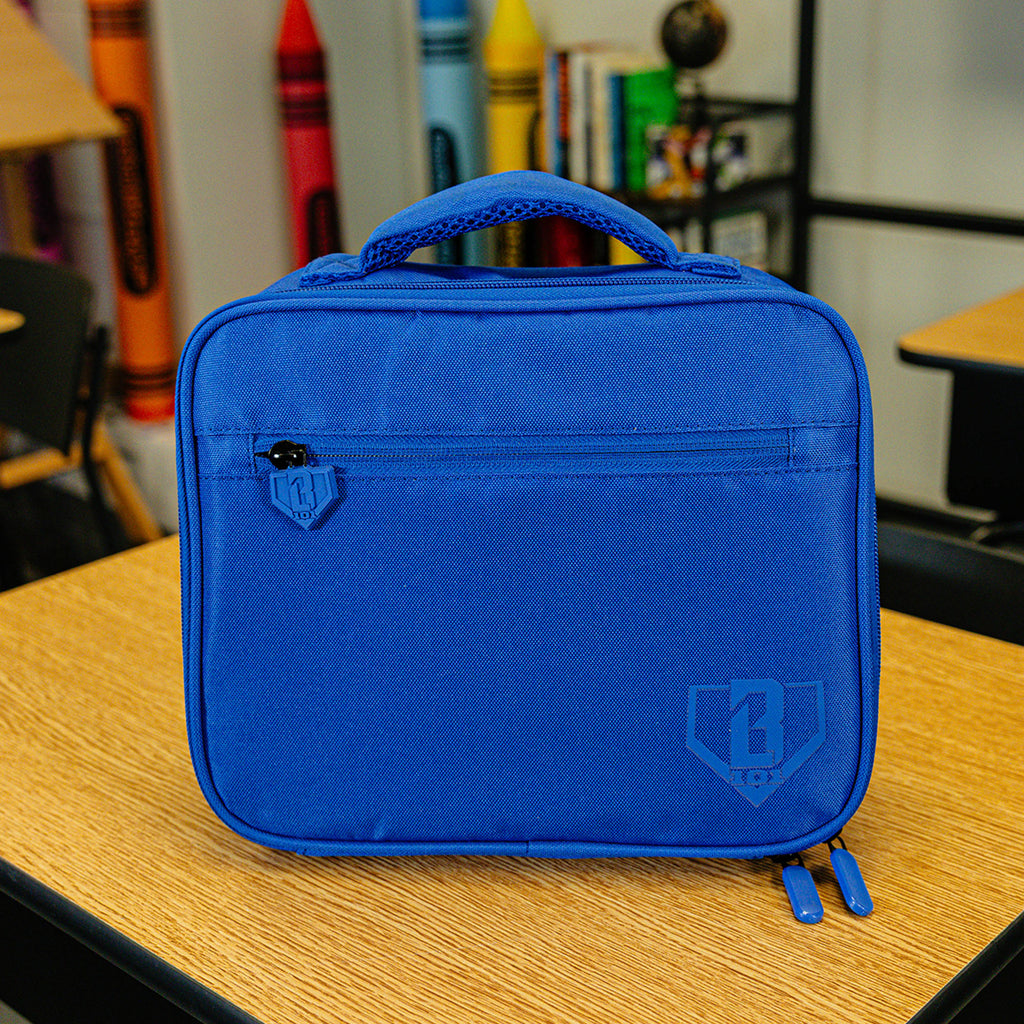 Adult model wearing blue lunch box with "SZN 2" design