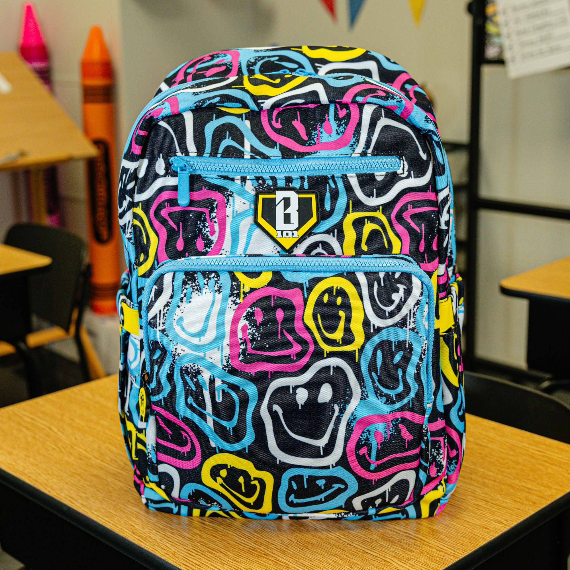 Multi-Color backpack with "Smiley Slugger Rotation" design — back view