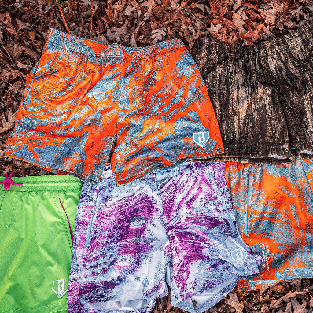 Colorful patterned shorts on a leafy background