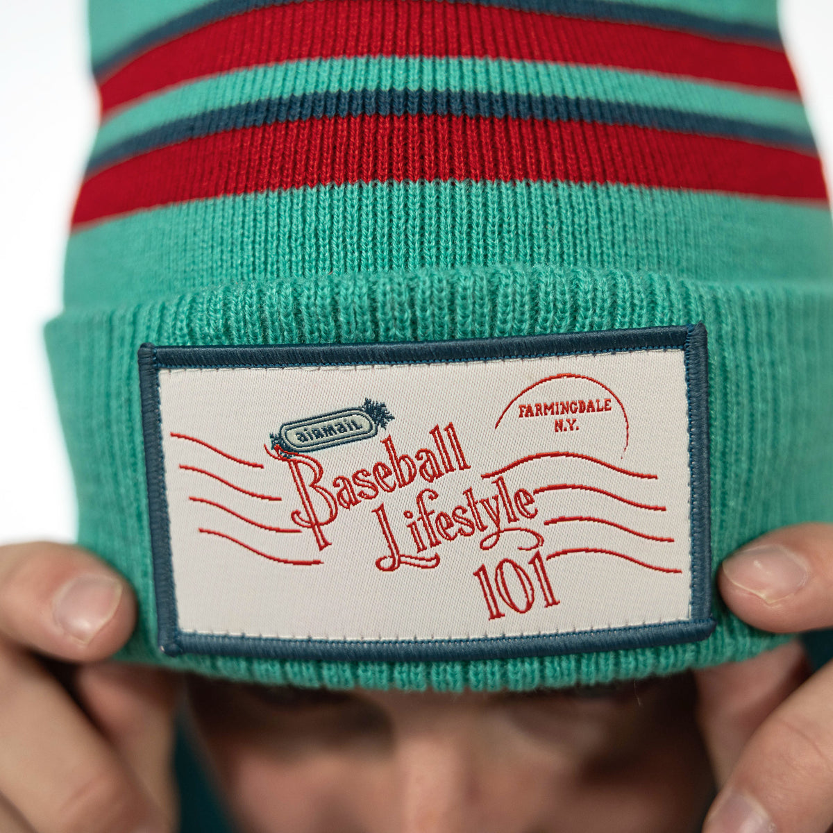 Blue beanie with "Holiday Stamps Beanie" design