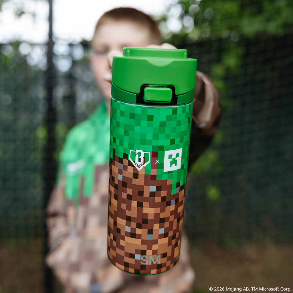 Multi-Color Mesa Loop Minecraft Grass Block water bottle with covered straw — lifestyle