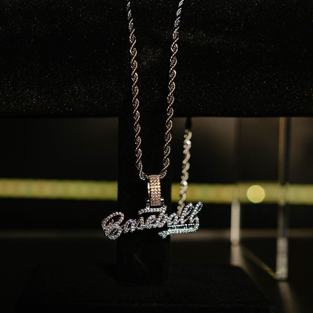 White Gold BL101 Established necklace hanging on a display stand against a black background