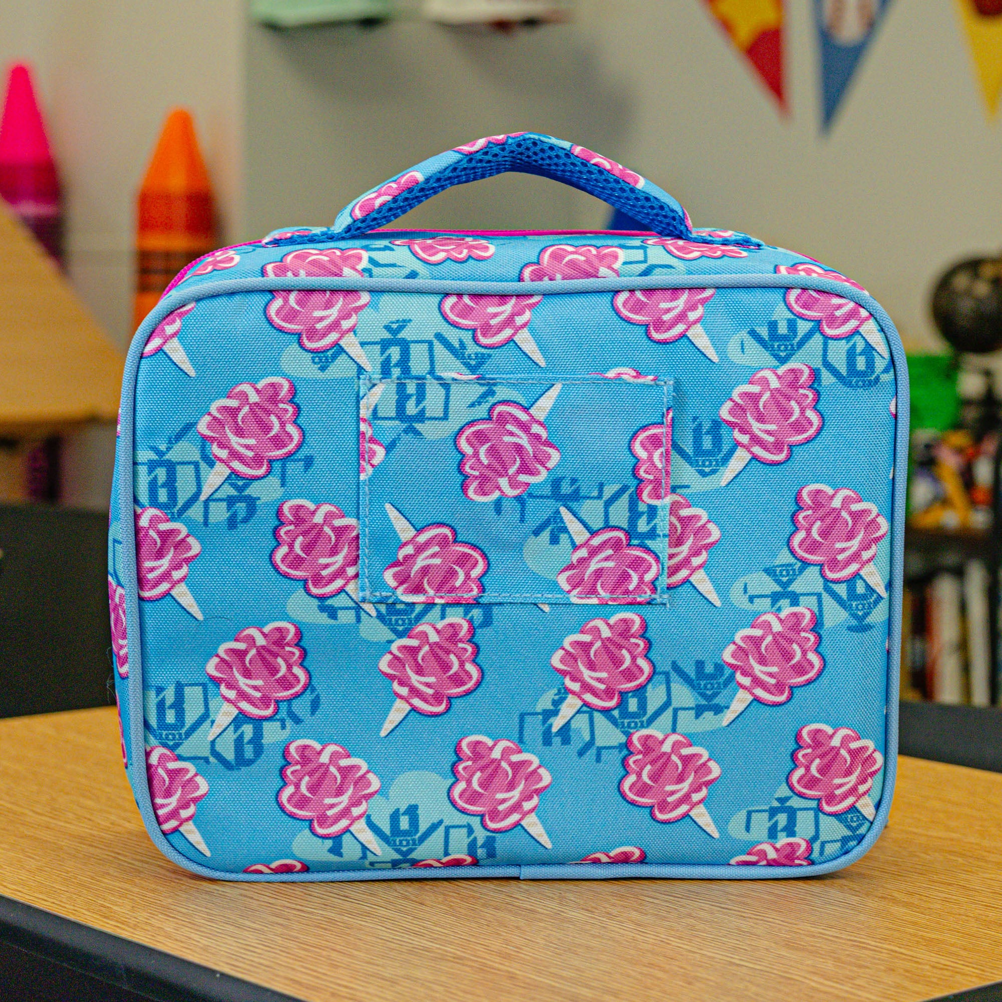 Adult model wearing multi-color lunch box with "Cotton Candy SZN 2" design