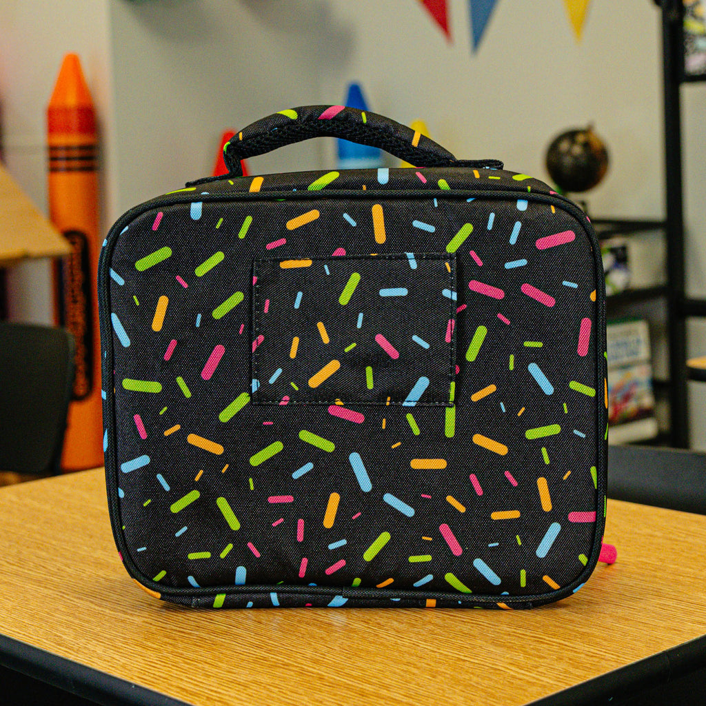 Adult model wearing black lunch box with "Midnight Sundae SZN 2" design