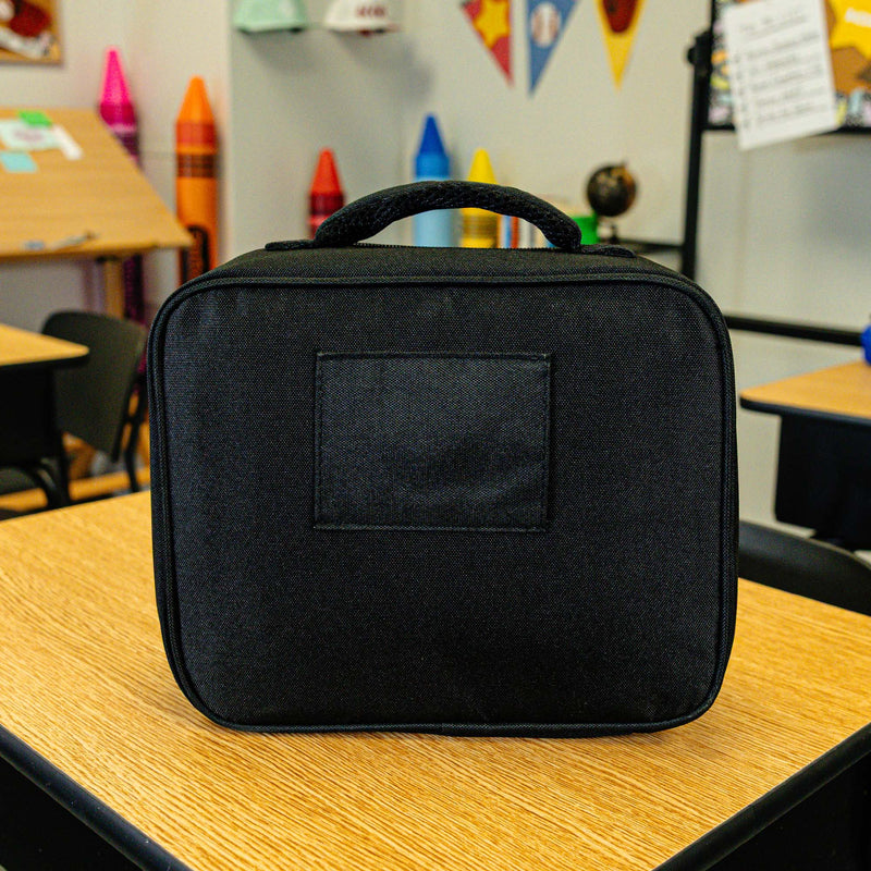 Adult model wearing black lunch box with "SZN 2" design