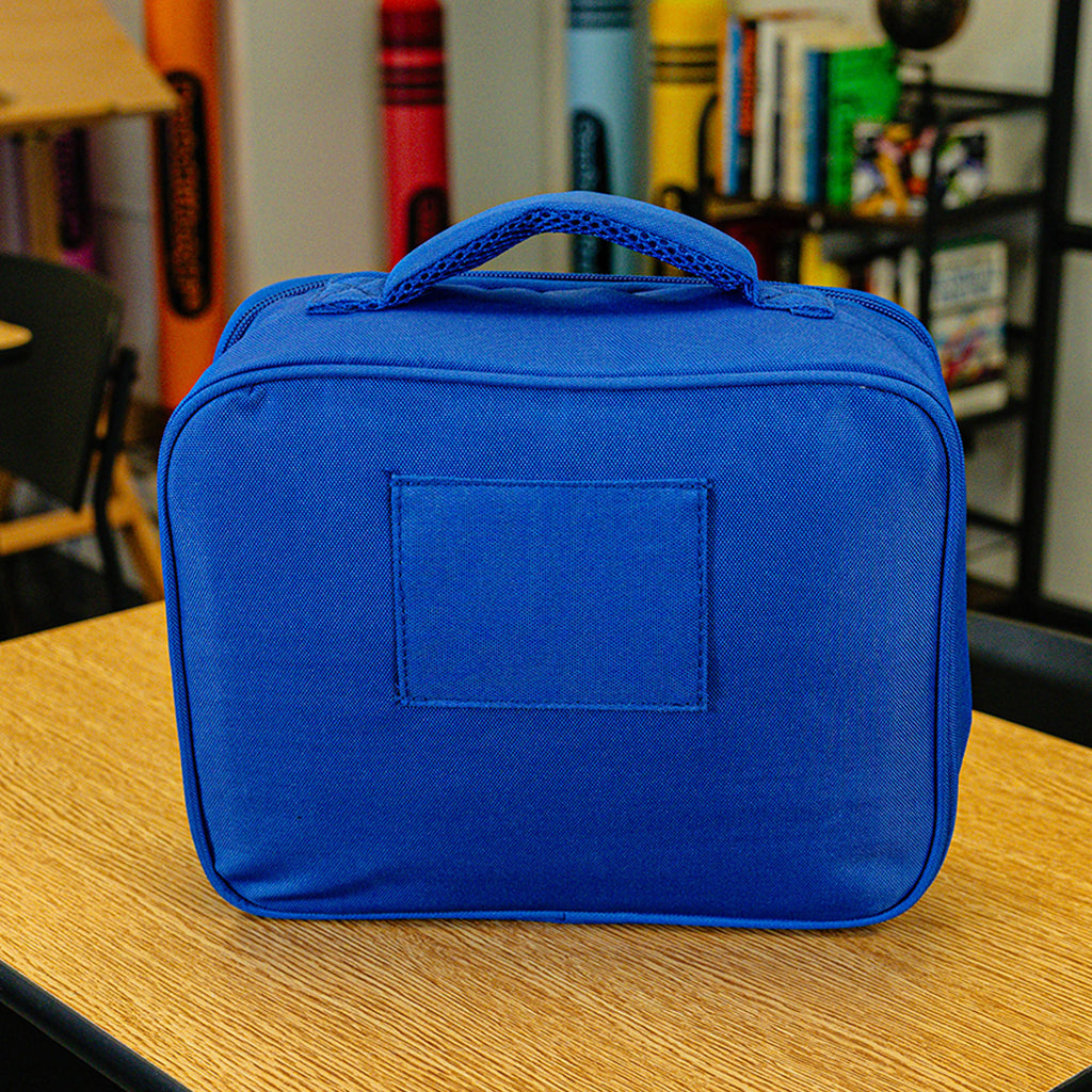 Adult model wearing blue lunch box with "SZN 2" design