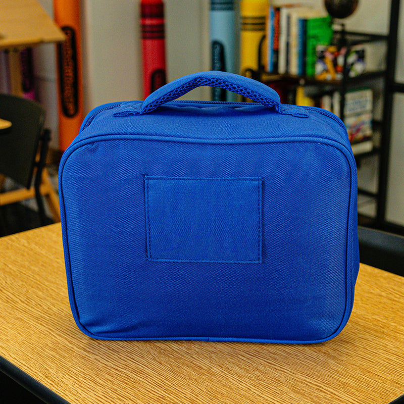 Adult model wearing blue lunch box with "SZN 2" design