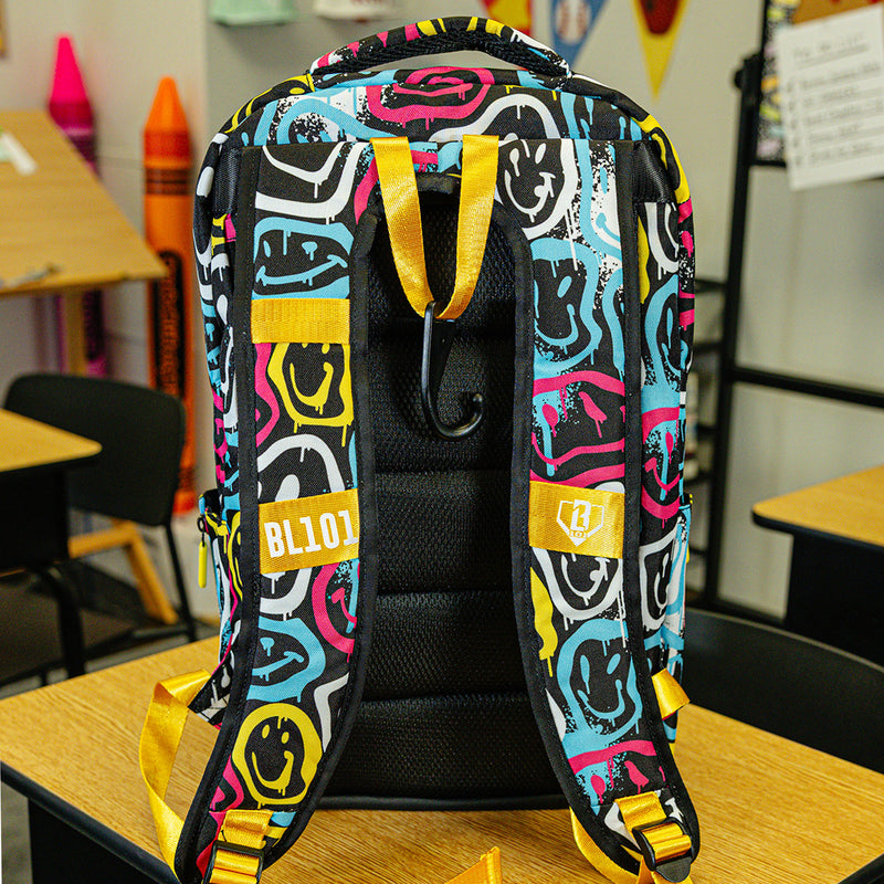 Multi-Color backpack with "Smiley Slugger SZN 2" design — back view