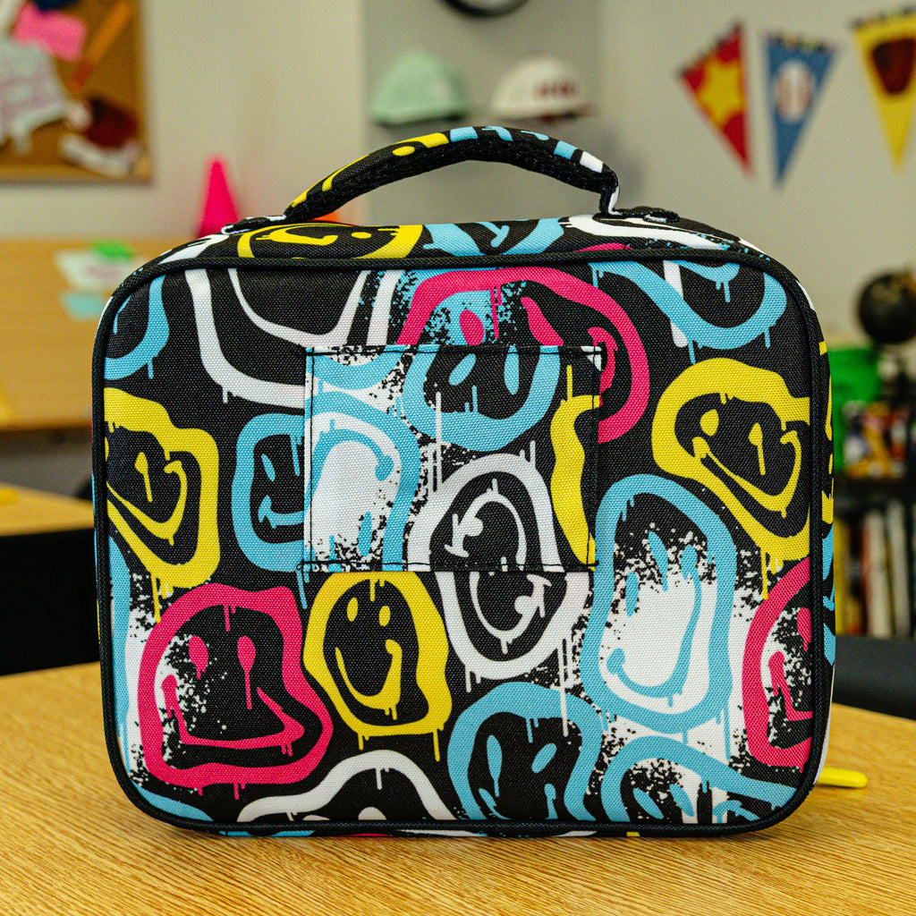 Adult model wearing multi-color lunch box with "Smiley Slugger SZN 2" design