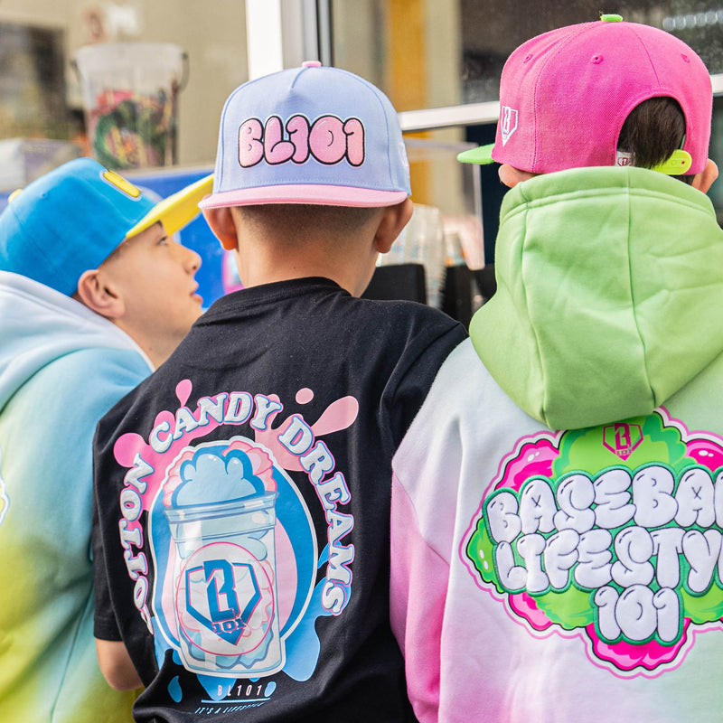 Three children wearing colorful caps and hoodies with Baseball Lifestyle 101 graphic designs.