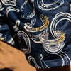 Close-up of blue shorts with horseshoe and baseball lifestyle text