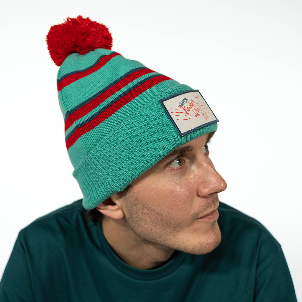 Blue beanie with "Holiday Stamps Beanie" design