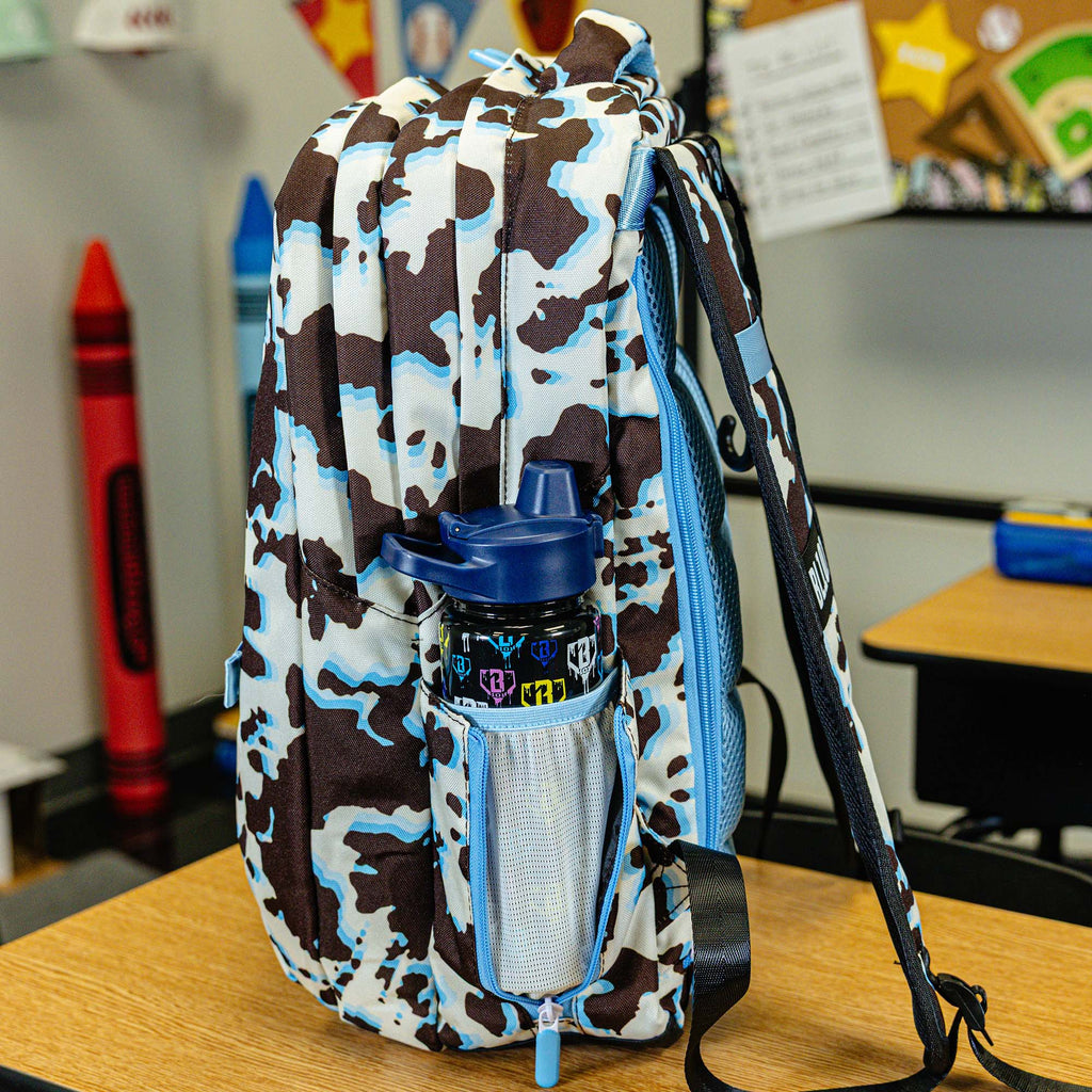 Multi-Color backpack with "Cowhide Curveball SZN 2" design — back view