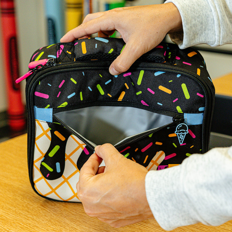 Adult model wearing black lunch box with "Midnight Sundae SZN 2" design