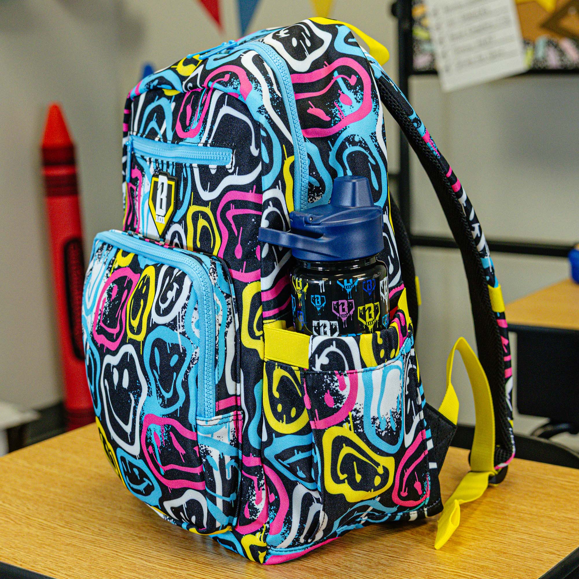 Multi-Color backpack with "Smiley Slugger Rotation" design — back view
