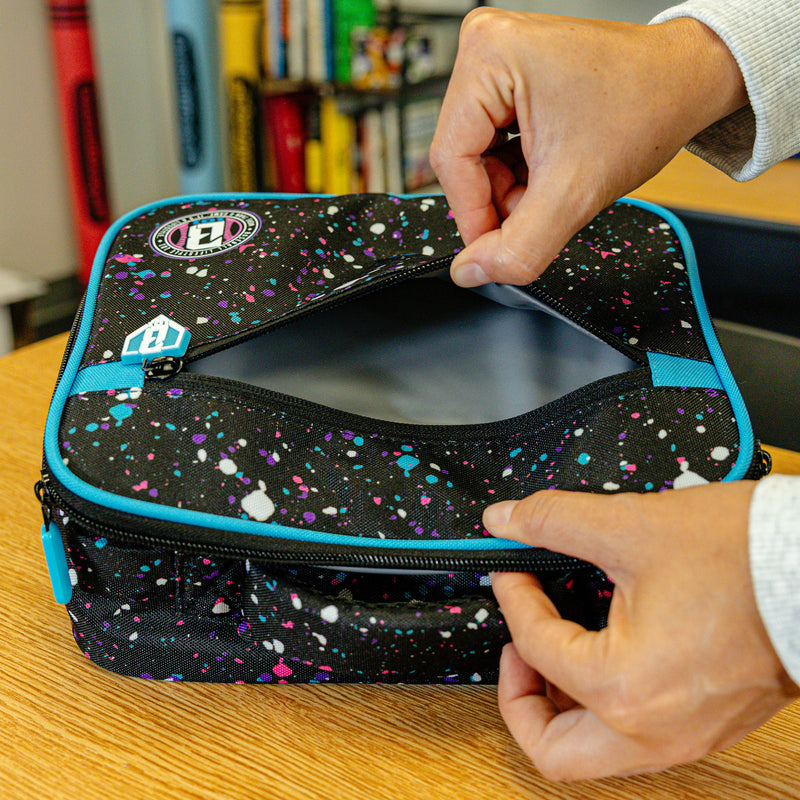 Adult model wearing black lunch box with "Splatter SZN 2" design