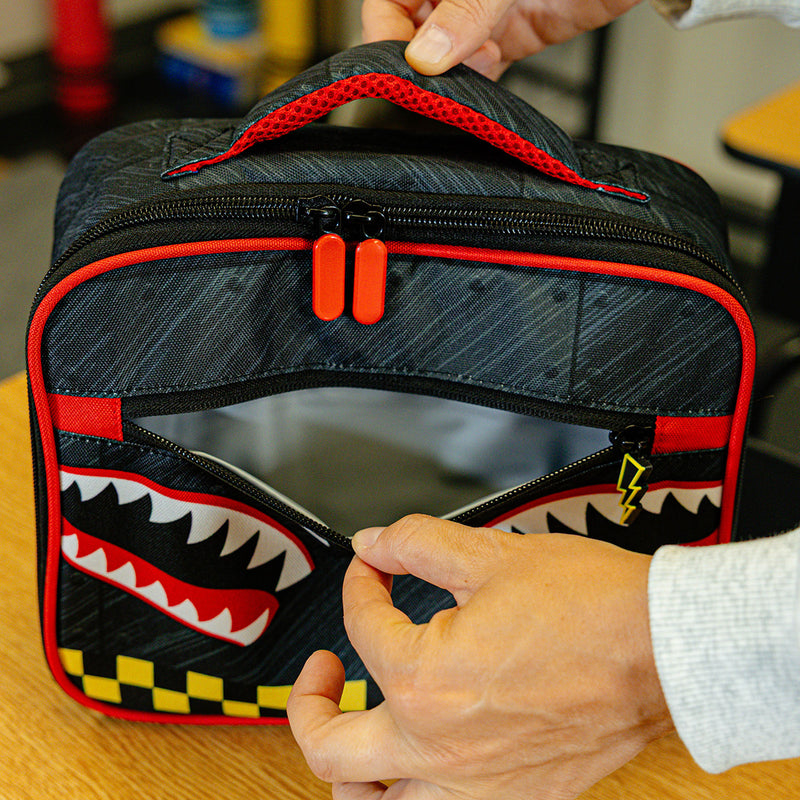 Adult model wearing multi-color lunch box with "Unit 101 SZN 2" design