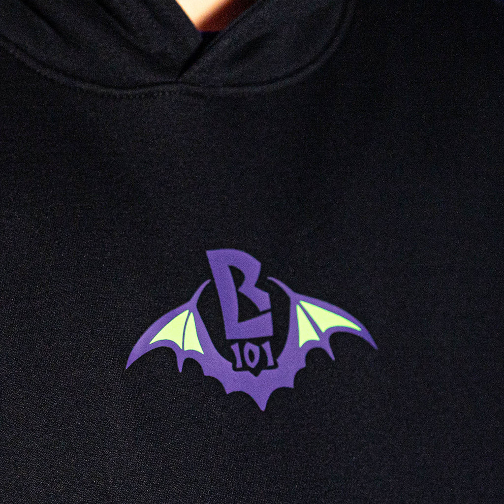 Adult model wearing black Bat Crest hoodie