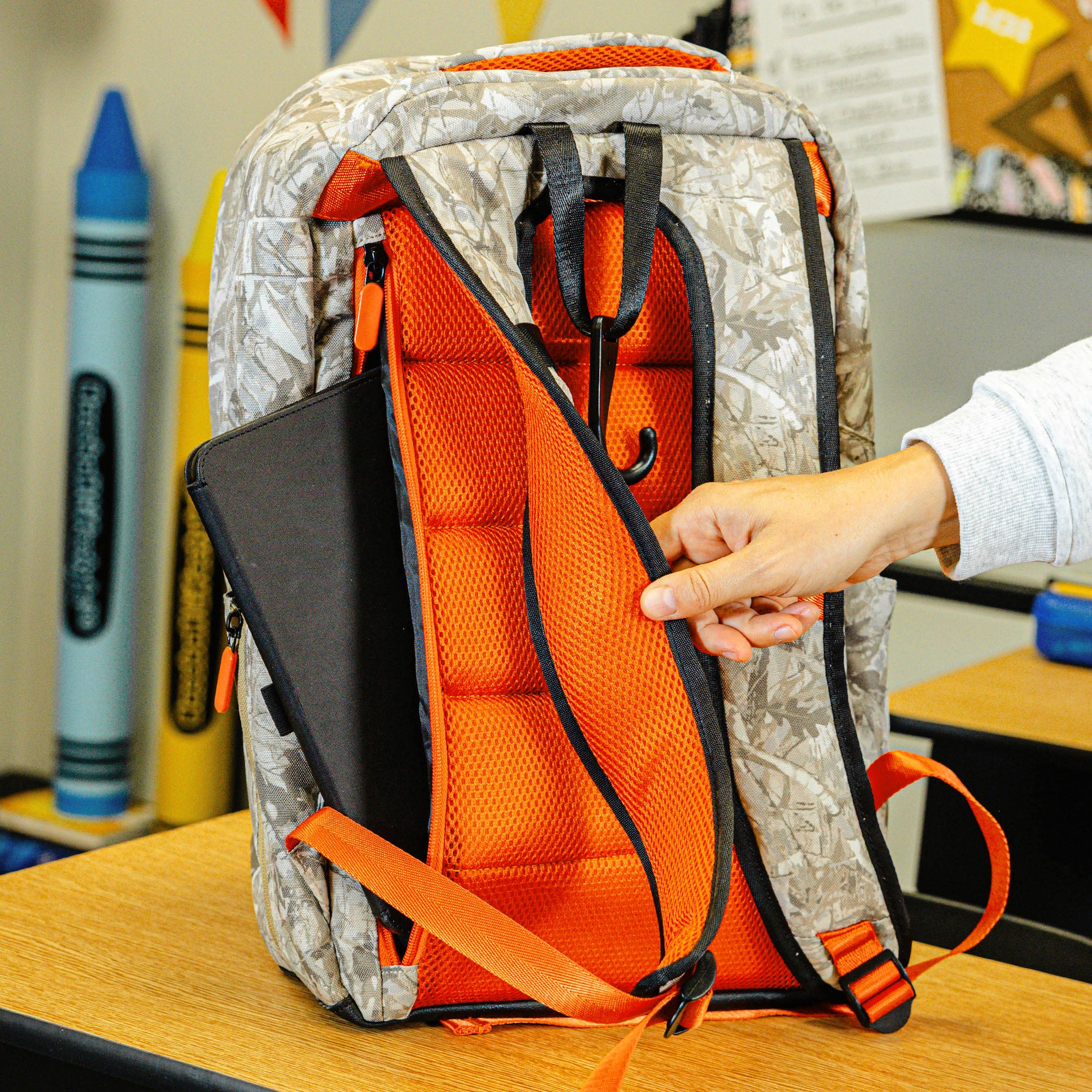 Multi-Color backpack with "Born To Fly SZN 2" design — back view