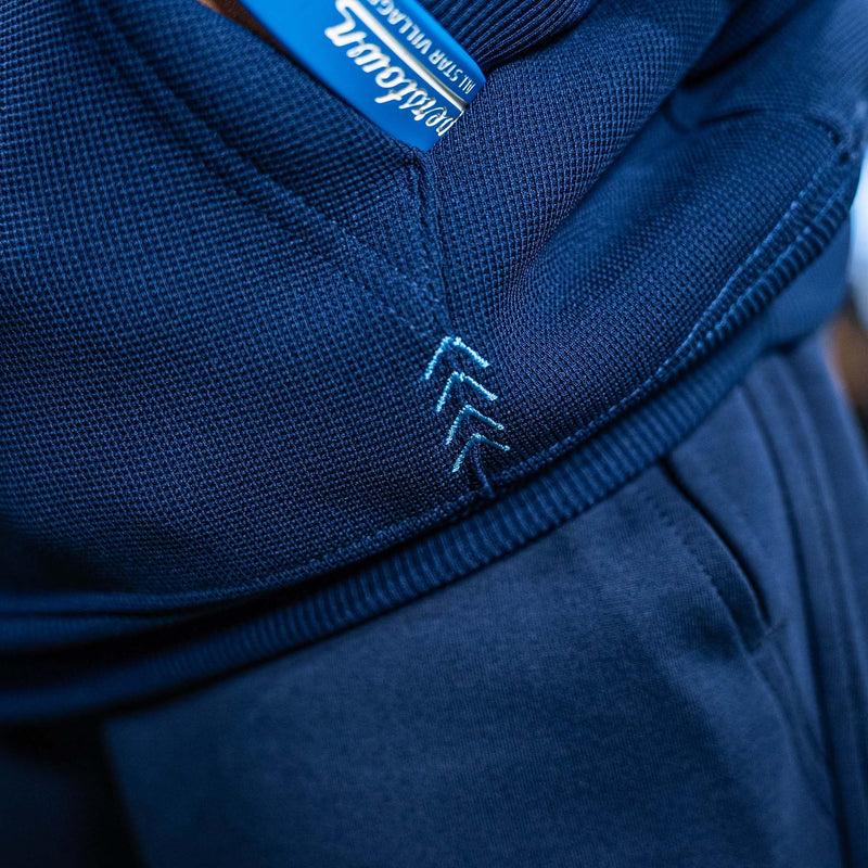 Close-up of a blue hoodie with light blue stitching 