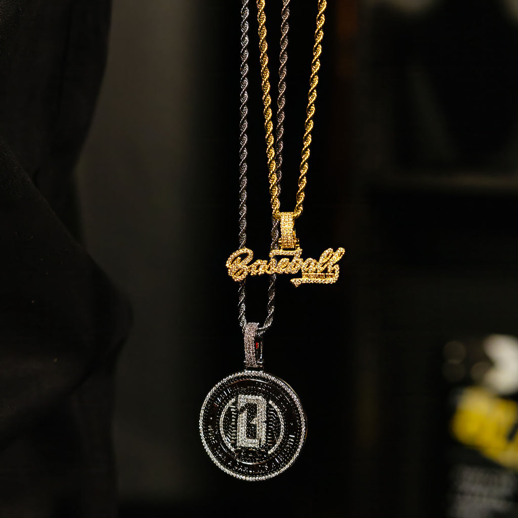 White Gold BL101 Medallion necklace hanging against a black background