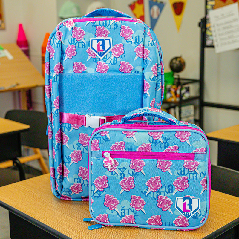 Adult model wearing multi-color lunch box with "Cotton Candy SZN 2" design