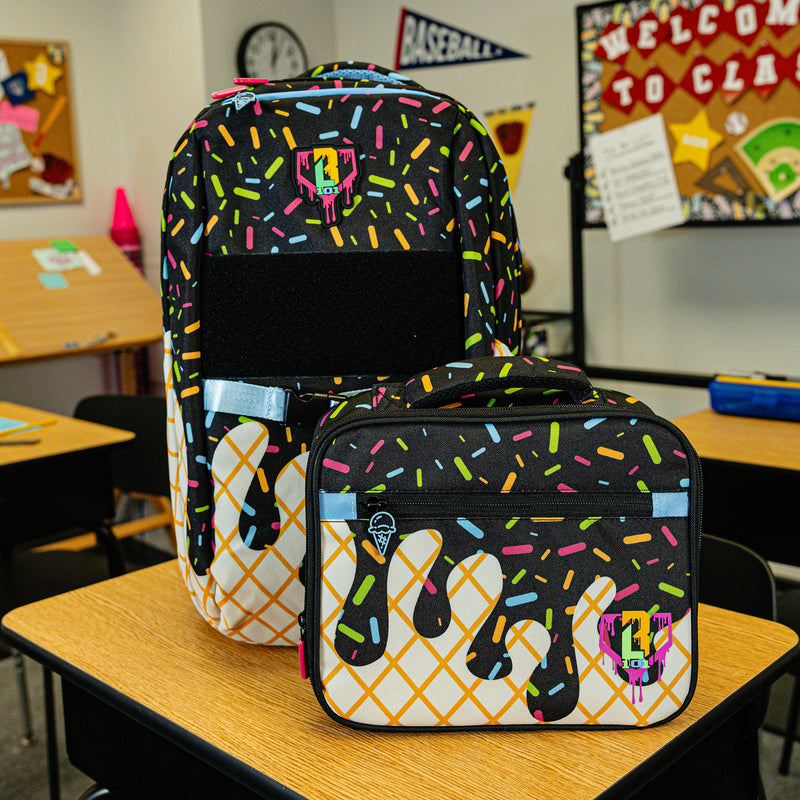 Adult model wearing black lunch box with "Midnight Sundae SZN 2" design