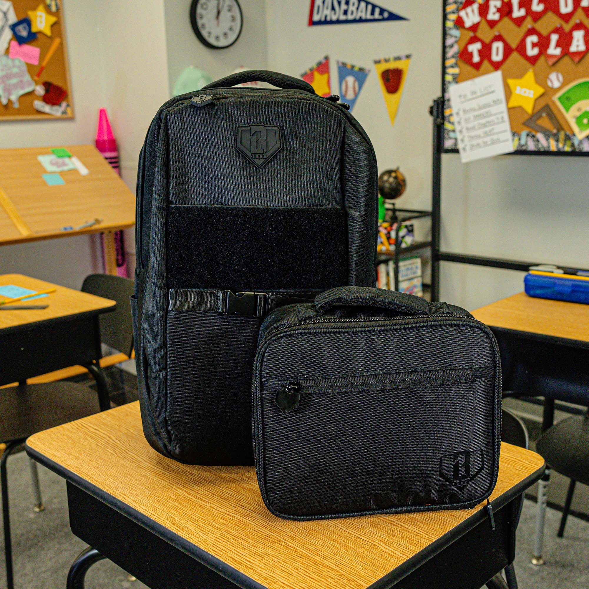 Adult model wearing black lunch box with "SZN 2" design