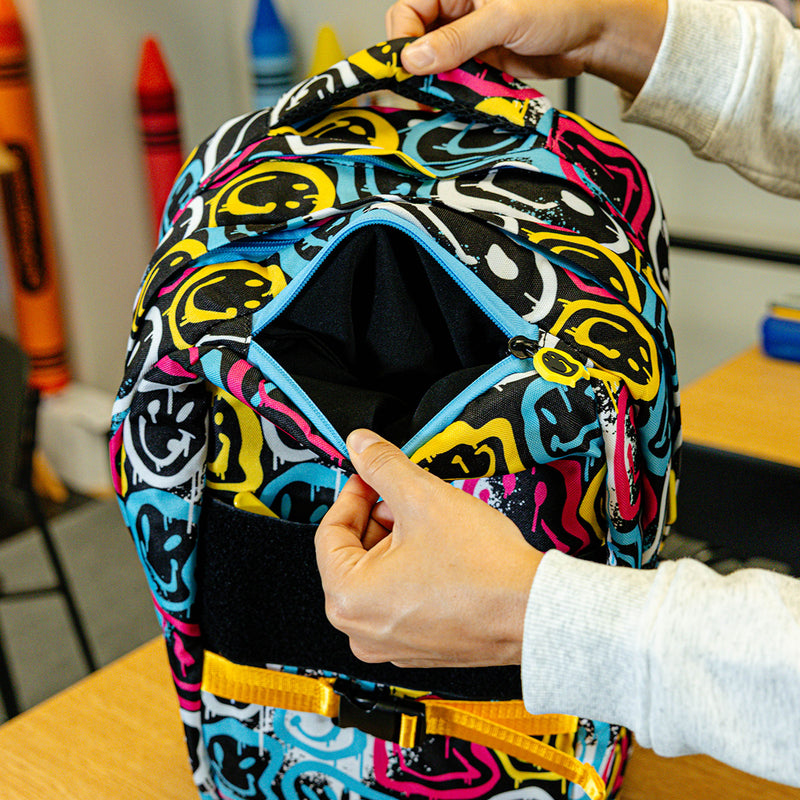 Multi-Color backpack with "Smiley Slugger SZN 2" design — back view