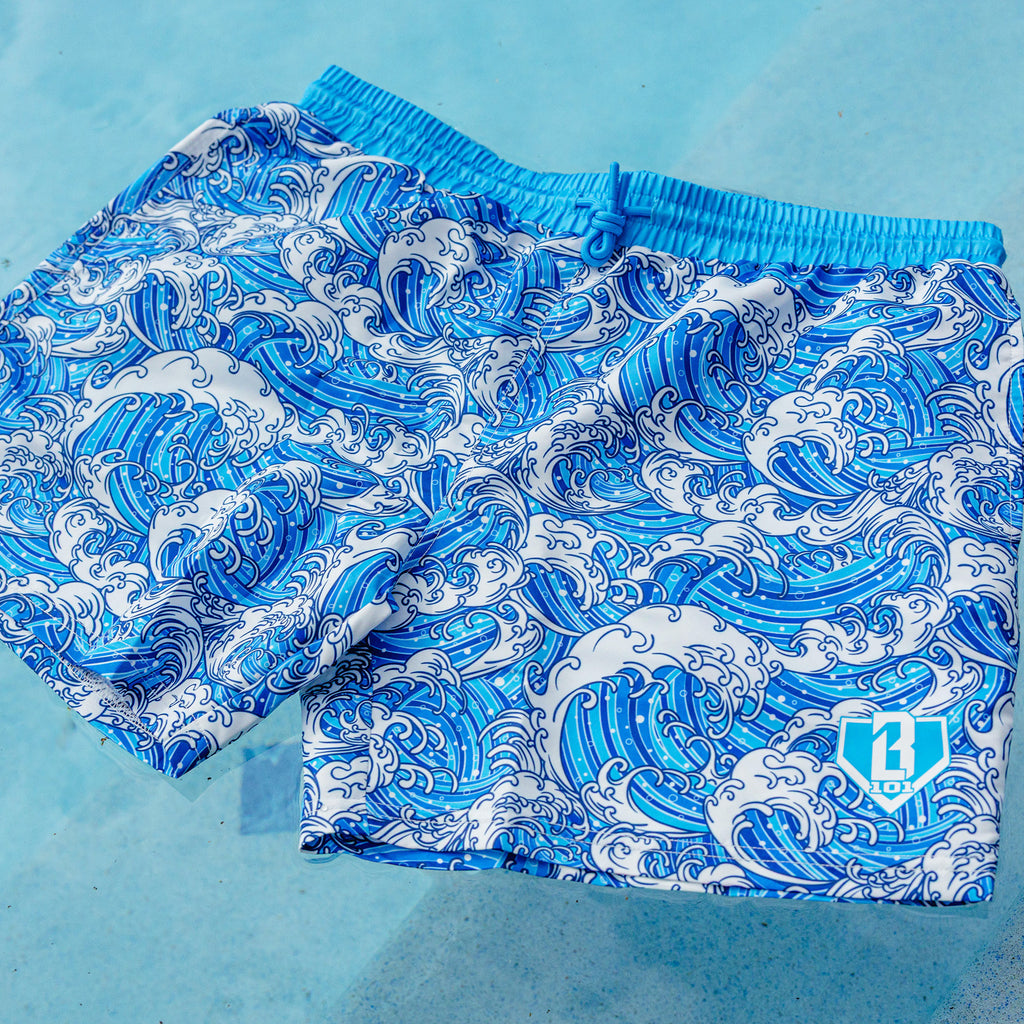 Blue and white wave patterned shorts on a white background