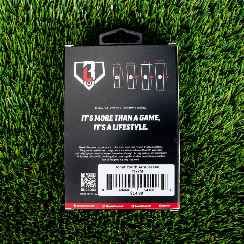 Back of BL101 arm sleeve retail box on green turf showing size chart brand tagline and Donut Youth Arm Sleeve barcode label priced at 14.99
