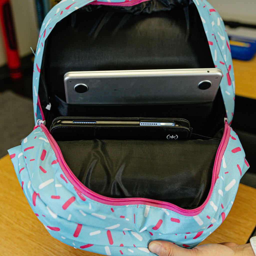 Blue backpack with "Cotton Candy Ice Cream  SZN 2" design — back view