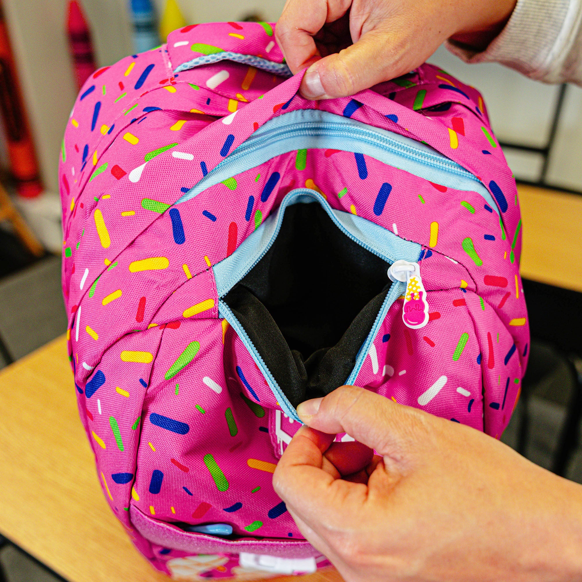 Pink backpack with "Strawberry Ice Cream  SZN 2" design — back view