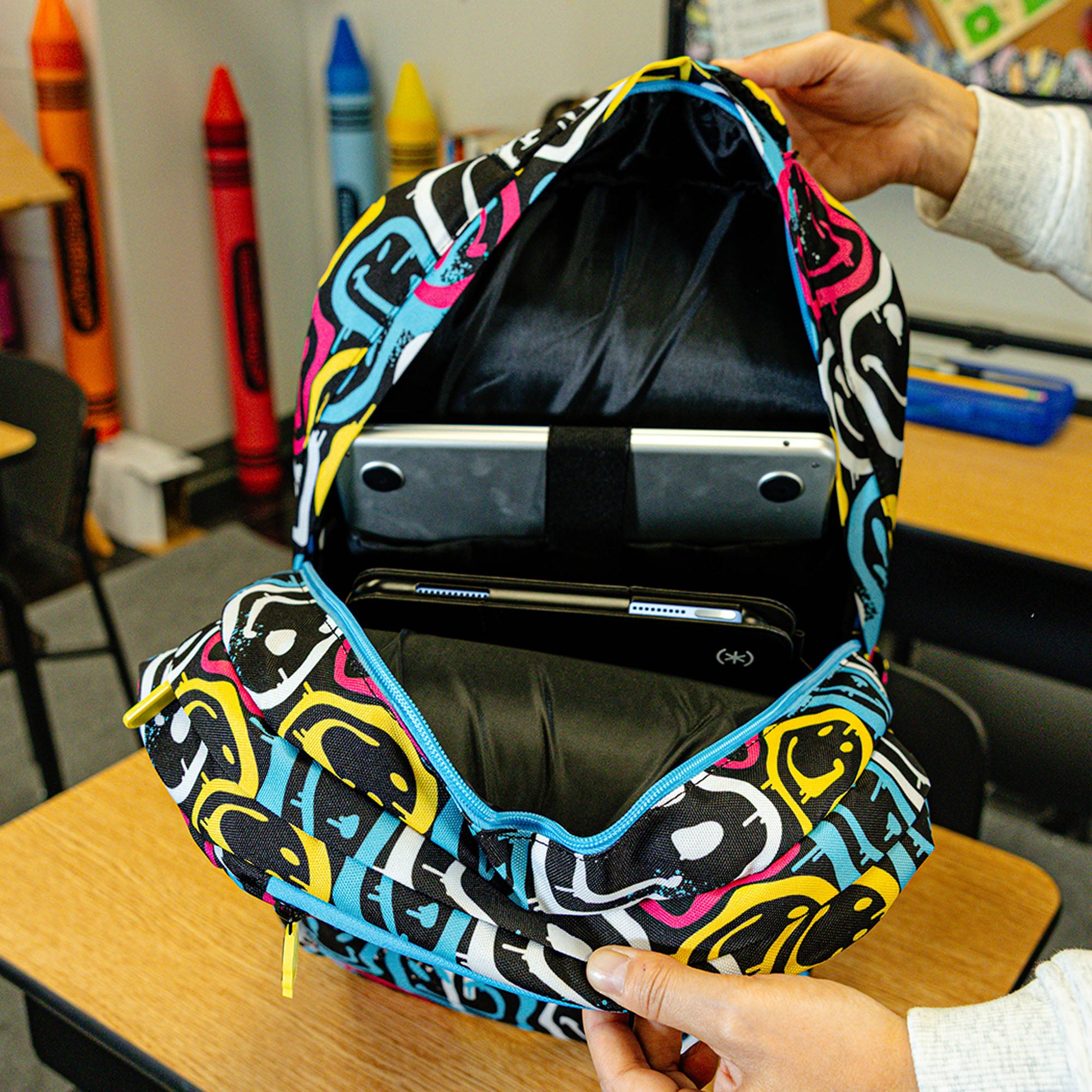 Multi-Color backpack with "Smiley Slugger SZN 2" design — back view