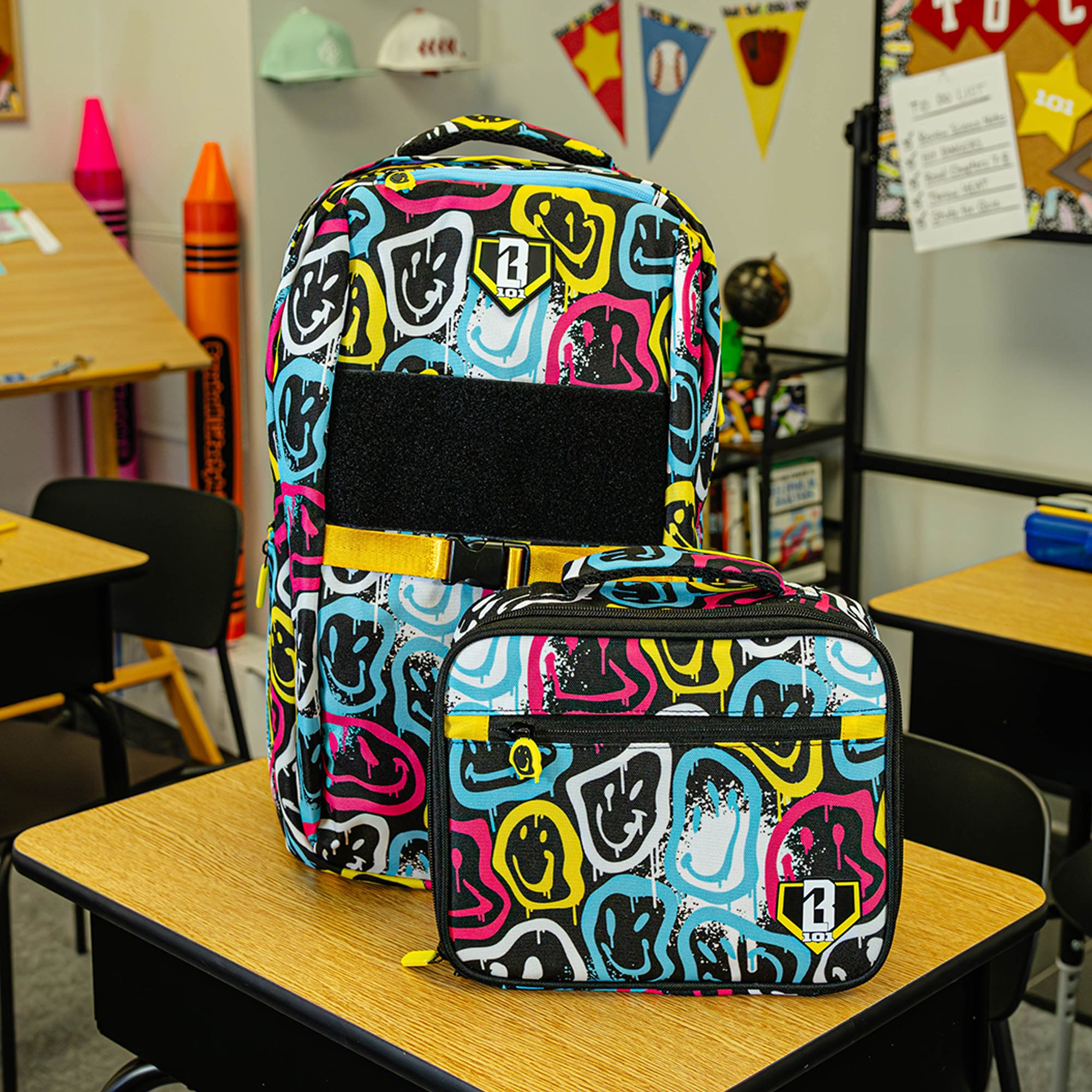 Multi-Color backpack with "Smiley Slugger SZN 2" design — back view