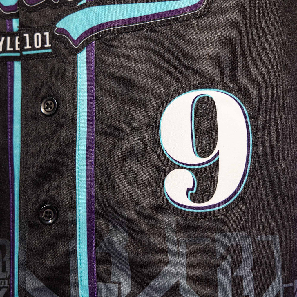 Close-up of a black sports jersey with number 9 and brand logo