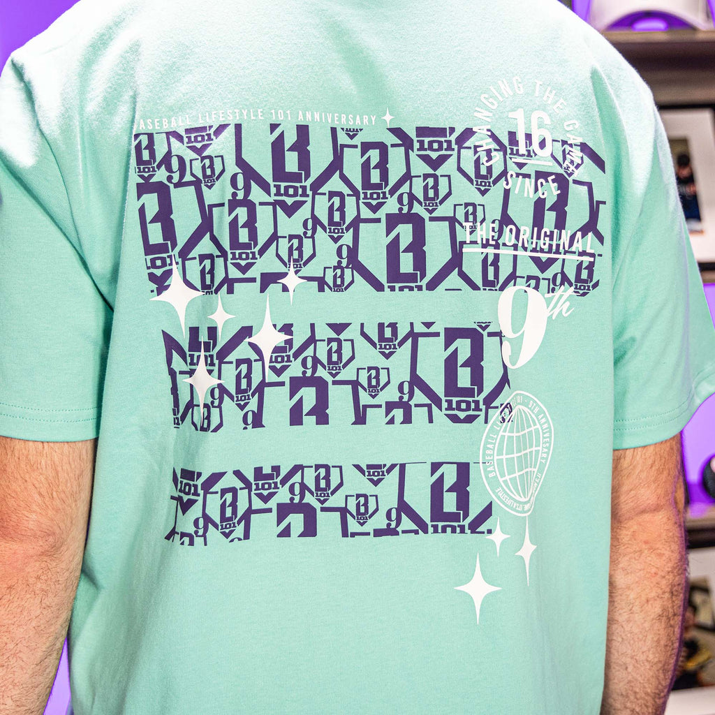 Light green t-shirt with purple BL101 logo 
and white 9th anniversary graphic design on a person wearing it.