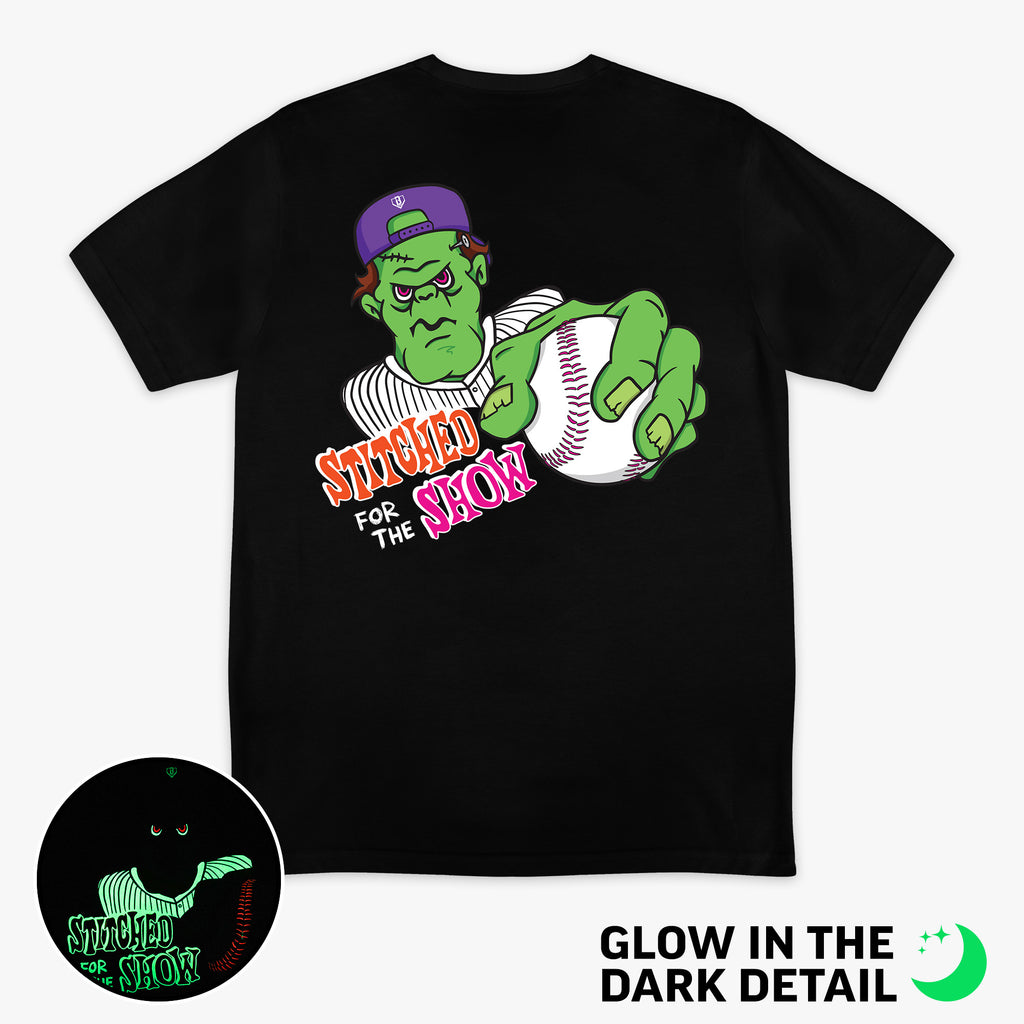 Black graphic tee with glow-in-the-dark "Stitched For The Show" detail