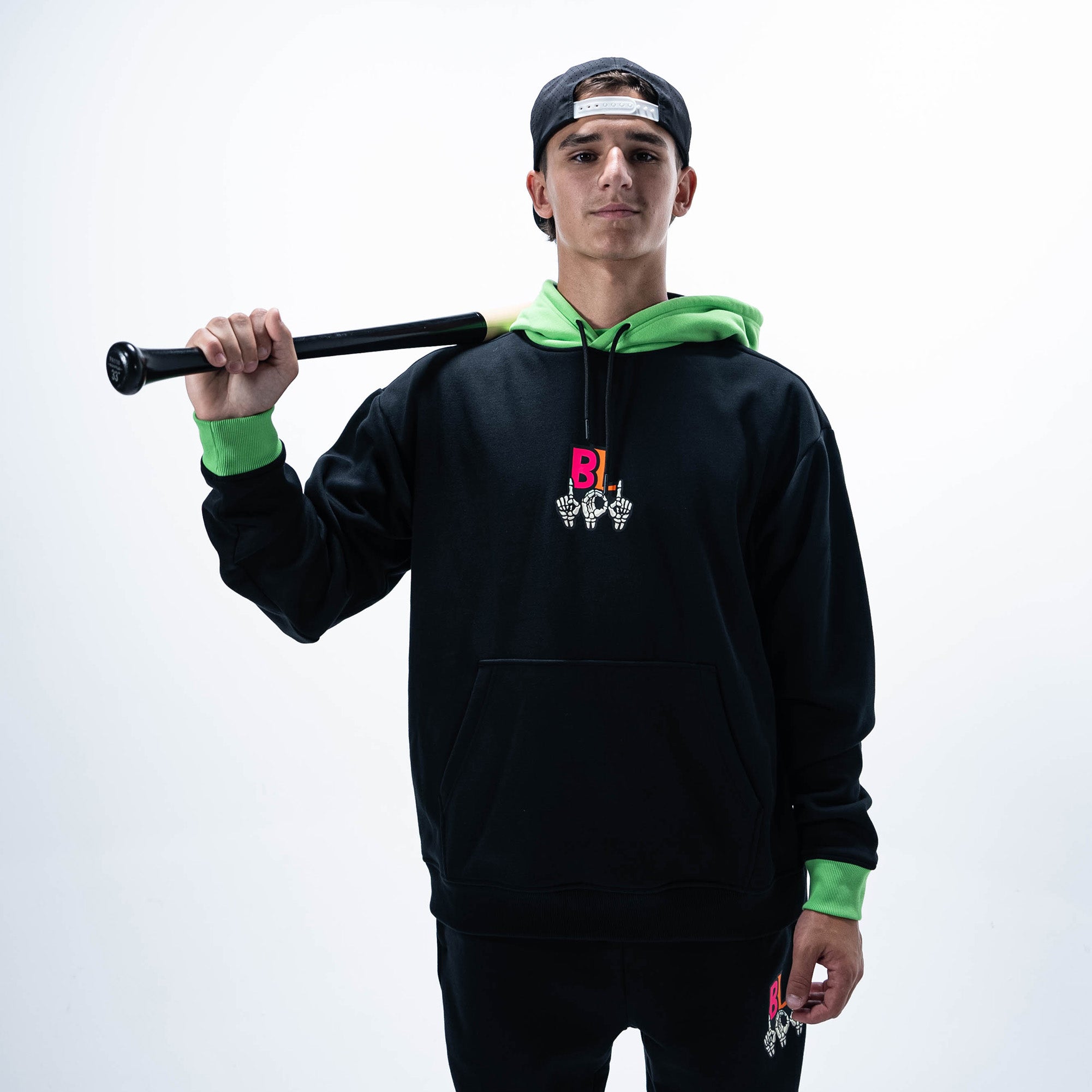 Adult model wearing black hoodie with "101 Skeleton" design