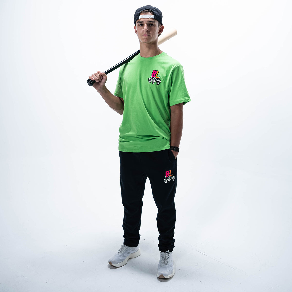 Adult model wearing black joggers with "101 Skeleton" design