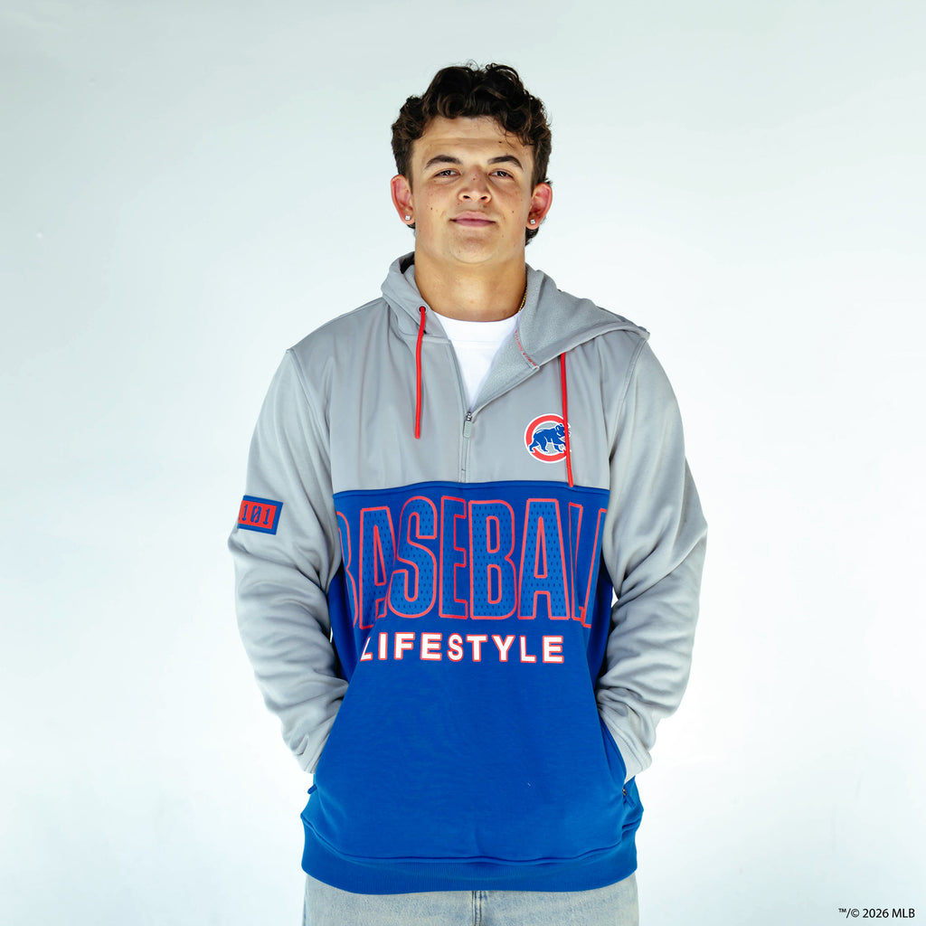 Adult model wearing blue Chicago Cubs Color Block quarter zip